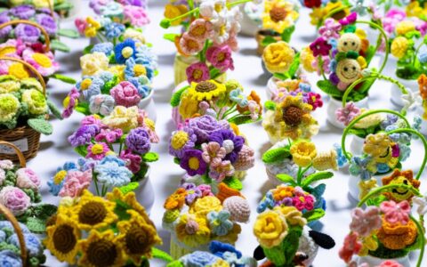 A vibrant array of crochet floral arrangements showcasing craftsmanship and creativity.