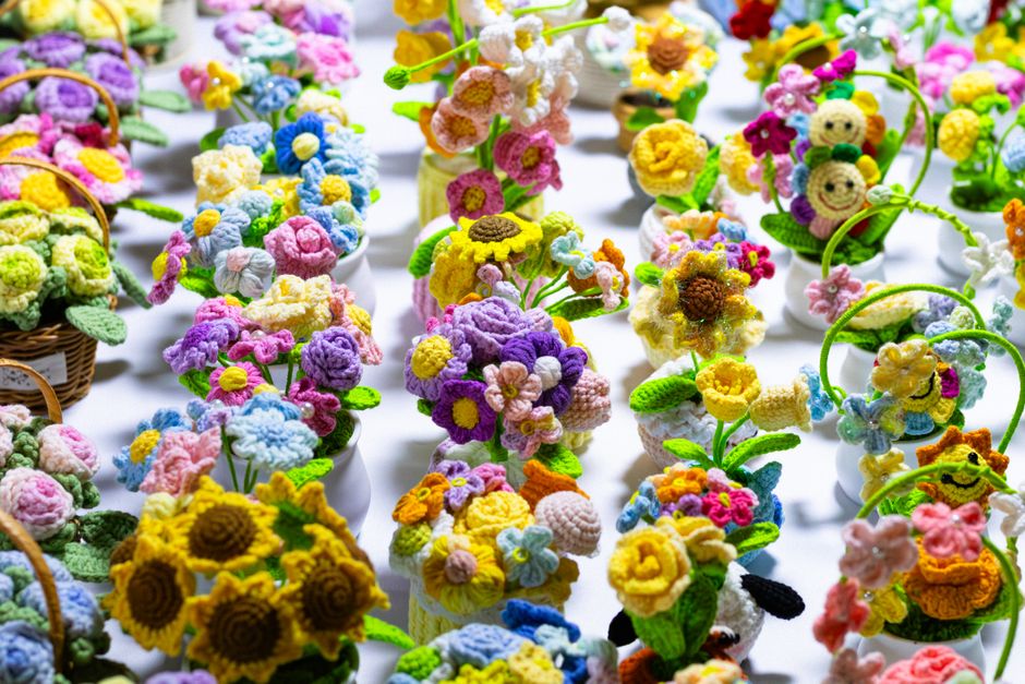 A vibrant array of crochet floral arrangements showcasing craftsmanship and creativity.